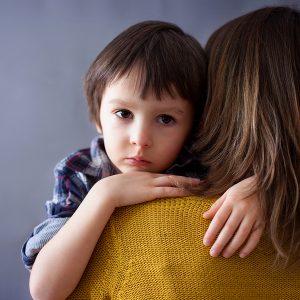worried-boy-with-mother