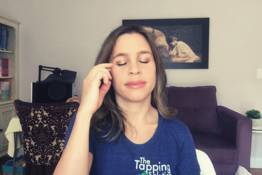 Jessica Ortner of The Tapping Solution showing how to do EFT Tapping, tapping on the side of the eye